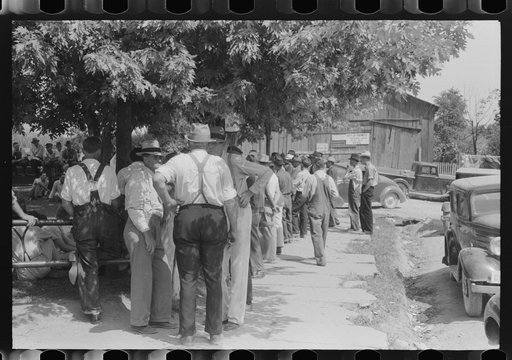 Mountaineers and farmers exchange news near courthouse on court day. Campton, Wolfe County, Kentucky