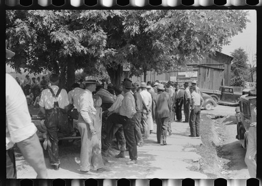 Untitled photo, possibly related to: Mountaineers and farmers exchange news near courthouse on court day. Campton, Wolfe County, Kentucky
