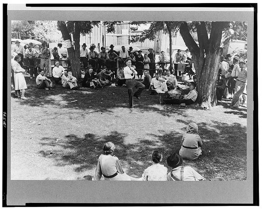 Community people listening to itinerant preacher in courtyard on court day, Campton, Kentucky