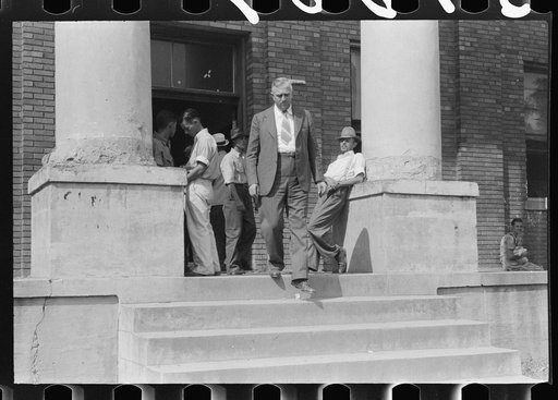 Farmers and townspeople in front of courthouse on court day, in Campton, Kentucky