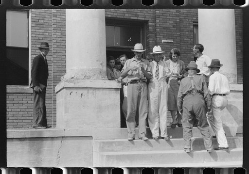 Farmers and townspeople in front of courthouse on court day, in Campton, Kentucky