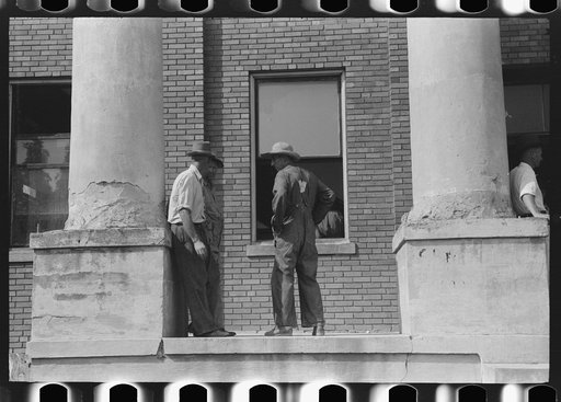 Untitled photo, possibly related to: Farmers and townspeople in front of courthouse on court day, in Campton, Kentucky