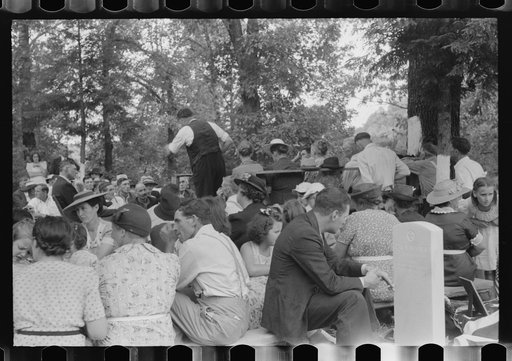 Untitled photo, possibly related to: Preacher, relatives and friends of the deceased at a memorial meeting near Jacson, Breathitt County, Kentucky. See general caption no. 1