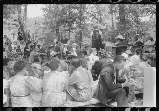 Untitled photo, possibly related to: Preacher, relatives and friends of the deceased at a memorial meeting near Jacson, Breathitt County, Kentucky. See general caption no. 1