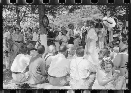 Untitled photo, possibly related to: Preacher, relatives and friends of the deceased at a memorial meeting near Jacson, Breathitt County, Kentucky. See general caption no. 1