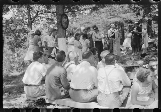 Untitled photo, possibly related to: Preacher, relatives and friends of the deceased at a memorial meeting near Jacson, Breathitt County, Kentucky. See general caption no. 1