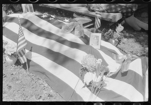 Grave decorated for a memorial meeting held annually for the deceased of each family, particularly in the summer and early fall when relatives can come from other communitites and states. Near Jackson, Kentucky