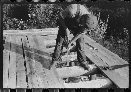 Untitled photo, possibly related to: Mountaineer laying the new floor in his neighbor's home near Jackson, Breathitt County, Kentucky