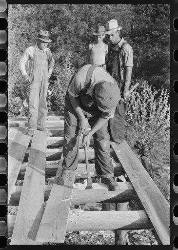 Untitled photo, possibly related to: Mountaineer laying the new floor in his neighbor's home near Jackson, Breathitt County, Kentucky