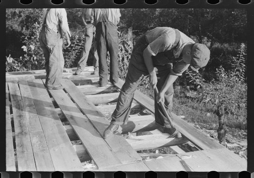 Untitled photo, possibly related to: Mountaineer laying the new floor in his neighbor's home near Jackson, Breathitt County, Kentucky