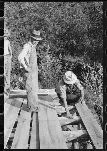 Untitled photo, possibly related to: Mountaineer laying the new floor in his neighbor's home near Jackson, Breathitt County, Kentucky