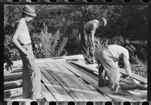 Untitled photo, possibly related to: Mountaineer laying the new floor in his neighbor's home near Jackson, Breathitt County, Kentucky