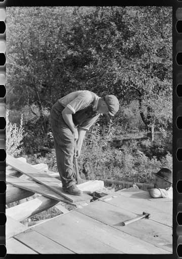 Untitled photo, possibly related to: Mountaineer laying the new floor in his neighbor's home near Jackson, Breathitt County, Kentucky