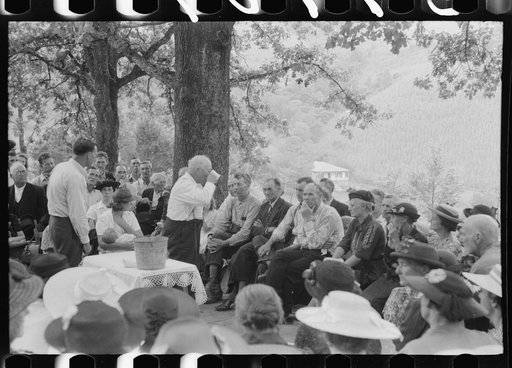 Untitled photo, possibly related to: Preacher, relatives and friends of the deceased at a memorial meeting near Jackson, Breathitt County, Kentucky. See general caption no. 1