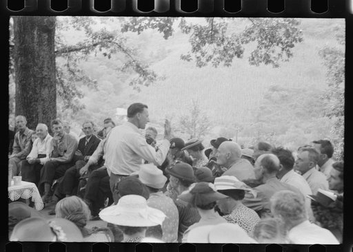 Untitled photo, possibly related to: Preacher, relatives and friends of the deceased at a memorial meeting near Jackson, Breathitt County, Kentucky. See general caption no. 1