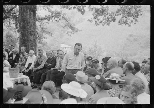 Untitled photo, possibly related to: Preacher, relatives and friends of the deceased at a memorial meeting near Jackson, Breathitt County, Kentucky. See general caption no. 1