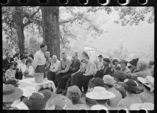 Untitled photo, possibly related to: Preacher, relatives and friends of the deceased at a memorial meeting near Jackson, Breathitt County, Kentucky. See general caption no. 1