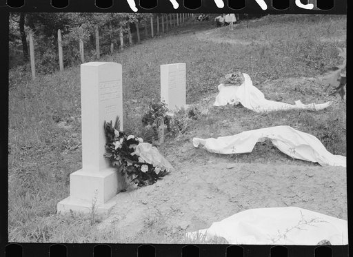 New graves decorated for an annual memorial meeting. In the mountains near Jackson, Kentucky. See general caption no. 1