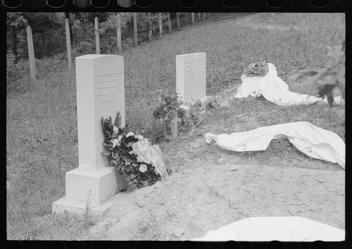 Untitled photo, possibly related to: New graves decorated for an annual memorial meeting. In the mountains near Jackson, Kentucky. See general caption no. 1