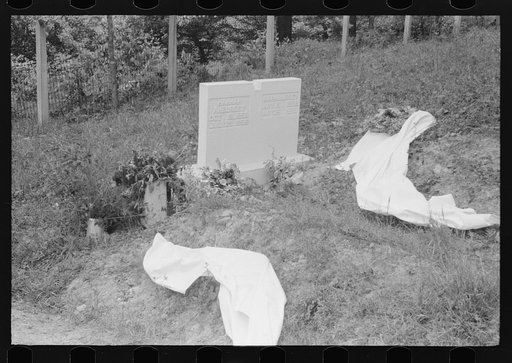 Untitled photo, possibly related to: New graves decorated for an annual memorial meeting. In the mountains near Jackson, Kentucky. See general caption no. 1