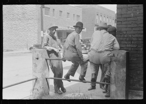 Untitled photo, possibly related to: Farmers hanging in front of stores on Saturday, Jackson, Kentucky