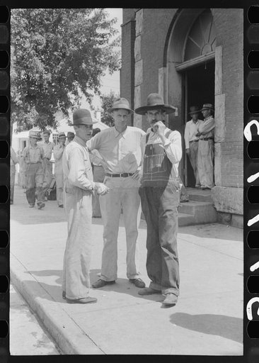 Untitled photo, possibly related to: Farmers hanging in front of stores on Saturday, Jackson, Kentucky