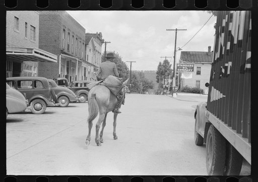 Farmer leaving town with supplies on horseback on Saturday, Jackson, Kentucky