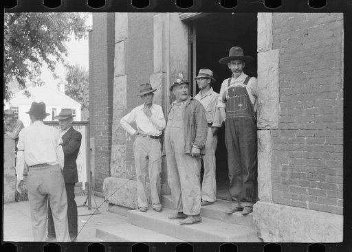 Untitled photo, possibly related to: Farmers hanging in front of stores on Saturday, Jackson, Kentucky