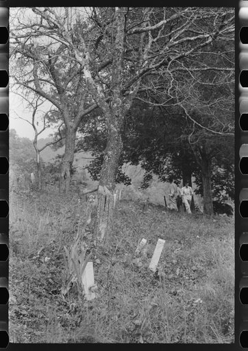 Untitled photo, possibly related to: Hand-carved gravestones in an old family cemetery where memorial meetings are held annually. In the mountains near Jackson, Kentucky. See general caption no. 1