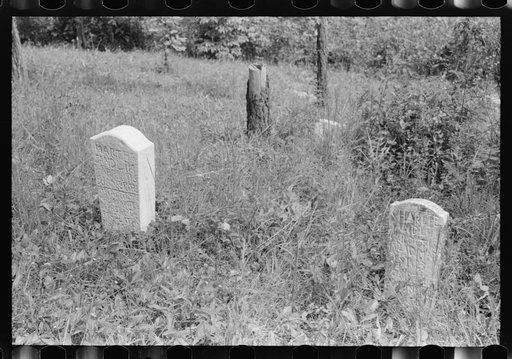 Hand-carved gravestones in an old family cemetery where memorial meetings are held annually. In the mountains near Jackson, Kentucky. See general caption no. 1