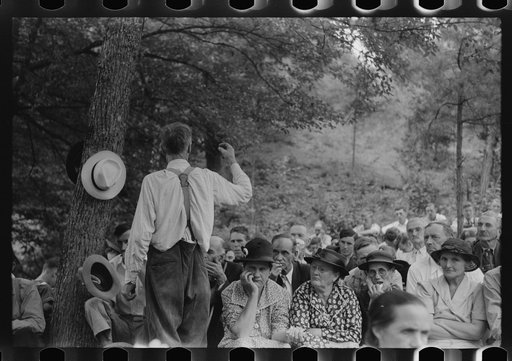 Untitled photo, possibly related to: Preacher, relatives and friends of the deceased at a memorial meeting near Jackson, Breathitt County, Kentucky. See general caption no. 1
