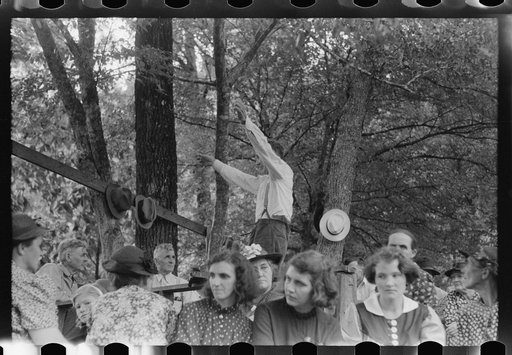 Untitled photo, possibly related to: Preacher, relatives and friends of the deceased at a memorial meeting near Jackson, Breathitt County, Kentucky. See general caption no. 1