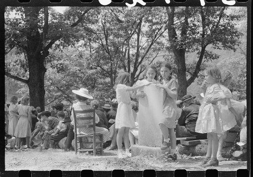 Friends of the deceased's family, at an annual memorial meeting in the family cemetery. In the mountains near Jackson, Kentucky. See general caption no. 1