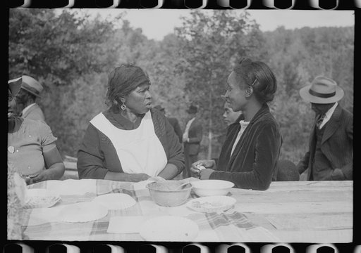 Outdoor picnic during the noon intermission of an all-day ministers and deacons meeting. Near Yanceyville, Caswell County, North Carolina