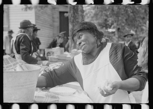 Untitled photo, possibly related to: Outdoor picnic during the noon intermission of an all-day ministers and deacons meeting. Near Yanceyville, Caswell County, North Carolina