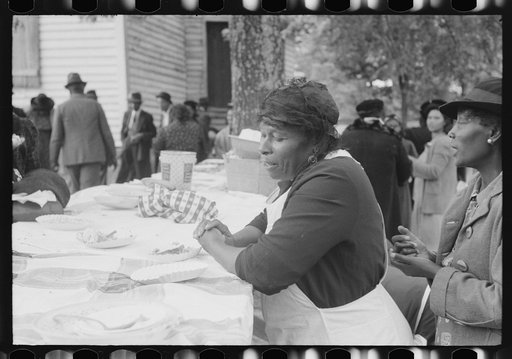 Untitled photo, possibly related to: Outdoor picnic during the noon intermission of an all-day ministers and deacons meeting. Near Yanceyville, Caswell County, North Carolina