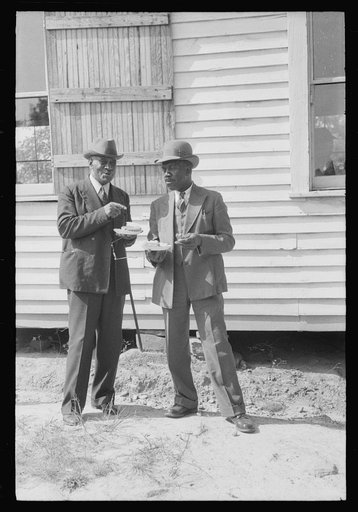 Outdoor picnic during the noon intermission of an all-day ministers and deacons meeting. Near Yanceyville, Caswell County, North Carolina