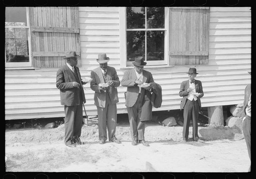 Untitled photo, possibly related to: Outdoor picnic during the noon intermission of an all-day ministers and deacons meeting. Near Yanceyville, Caswell County, North Carolina
