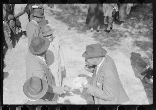 Untitled photo, possibly related to: Outdoor picnic during the noon intermission of an all-day ministers and deacons meeting. Near Yanceyville, Caswell County, North Carolina