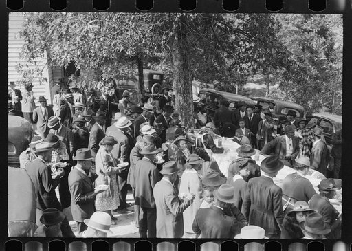 Untitled photo, possibly related to: Outdoor picnic during the noon intermission of an all-day ministers and deacons meeting. Near Yanceyville, Caswell County, North Carolina