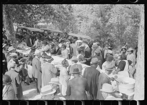 Untitled photo, possibly related to: Outdoor picnic during the noon intermission of an all-day ministers and deacons meeting. Near Yanceyville, Caswell County, North Carolina