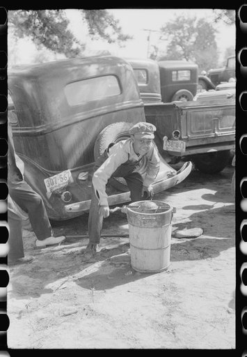 Untitled photo, possibly related to: Children making ice cream to be sold for the benefit of the church at a ministers and deacons meeting near Yanceyville, Caswell County, North Carolina