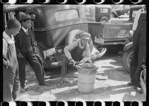 Untitled photo, possibly related to: Children making ice cream to be sold for the benefit of the church at a ministers and deacons meeting near Yanceyville, Caswell County, North Carolina