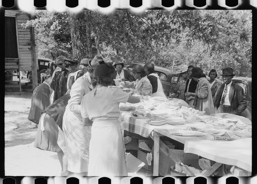 Untitled photo, possibly related to: Outdoor picnic during the noon intermission of an all-day ministers and deacons meeting. Near Yanceyville, Caswell County, North Carolina
