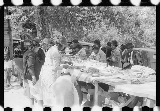 Untitled photo, possibly related to: Outdoor picnic during the noon intermission of an all-day ministers and deacons meeting. Near Yanceyville, Caswell County, North Carolina