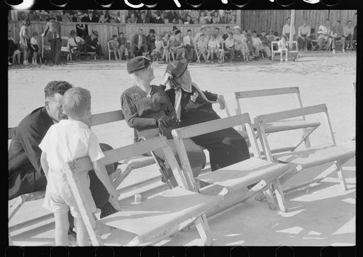 Yanceyville, North Carolina. Spectators listening to the county school superintendent speaking at the Caswell County Fair