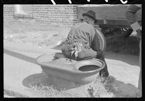 Untitled photo, possibly related to: Taking a load of tobacco into the warehouse for the auction sale. Danville, Virginia