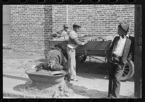 Untitled photo, possibly related to: Taking a load of tobacco into the warehouse for the auction sale. Danville, Virginia