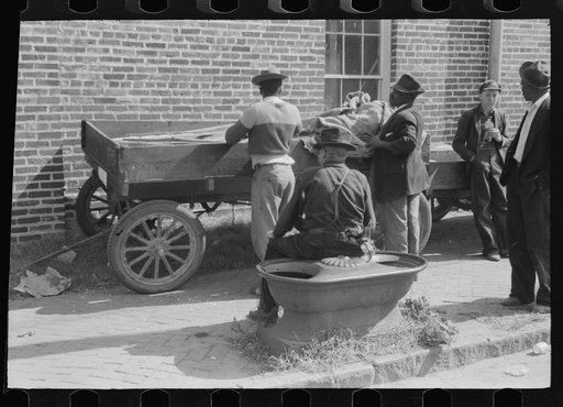 Untitled photo, possibly related to: Taking a load of tobacco into the warehouse for the auction sale. Danville, Virginia