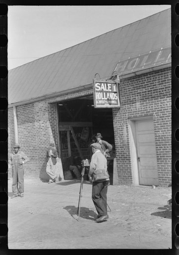Untitled photo, possibly related to: Taking a load of tobacco into the warehouse for the auction sale. Danville, Virginia